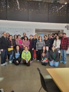 Large group of people posing indoors